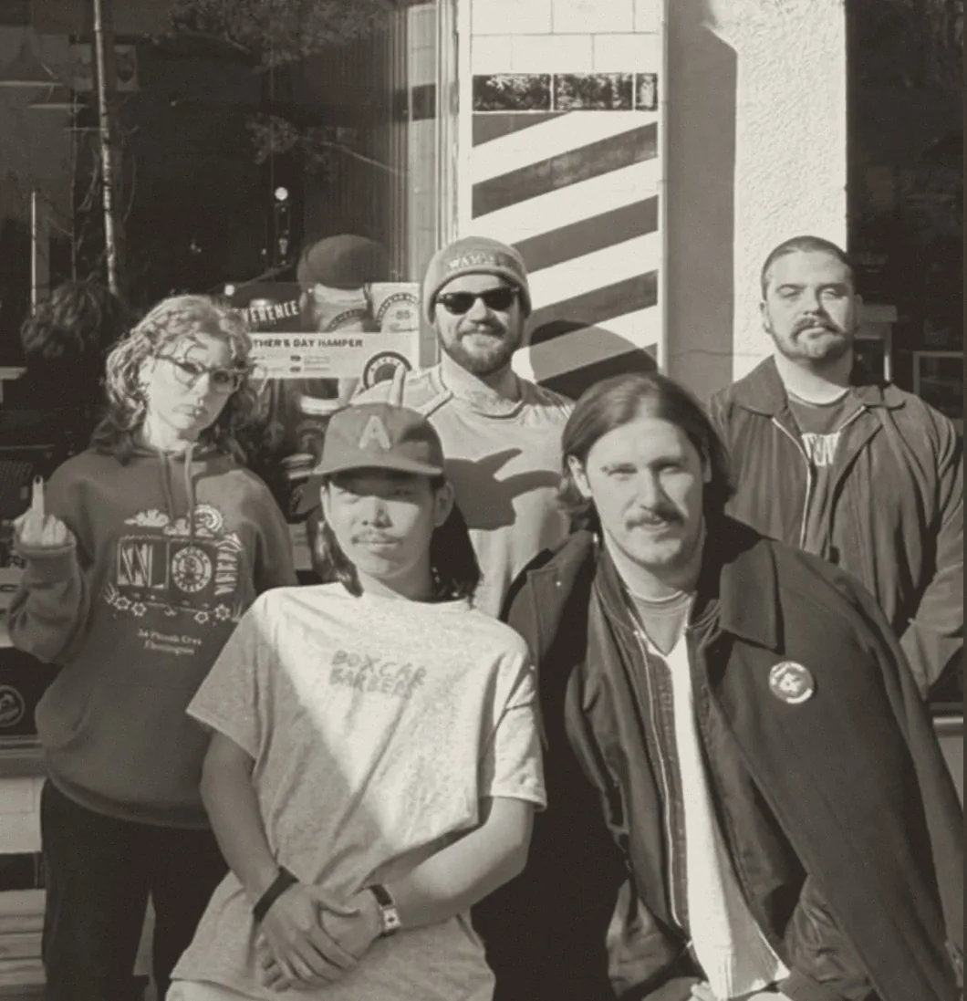 The Boxcar Barbers crew out front by the barber pole